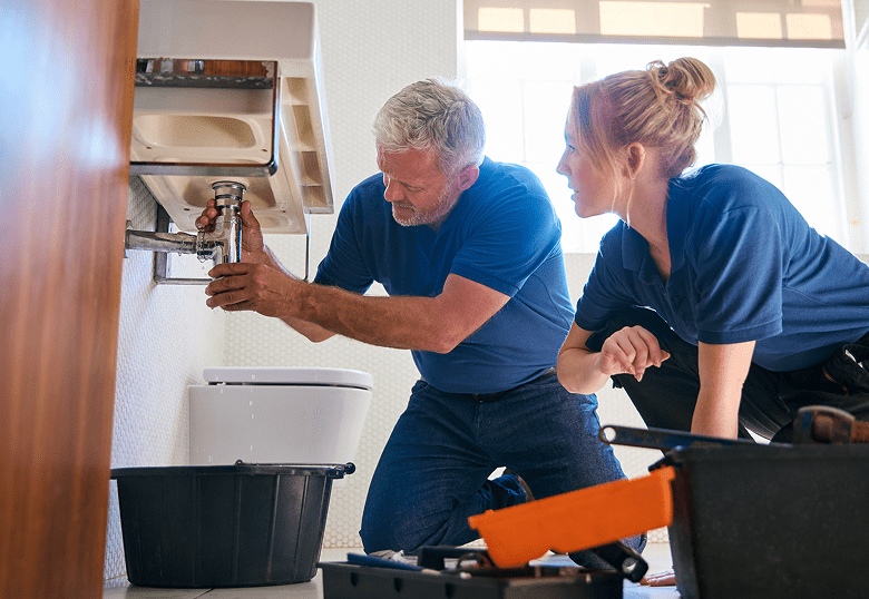 Teamwork in plumbing repair task